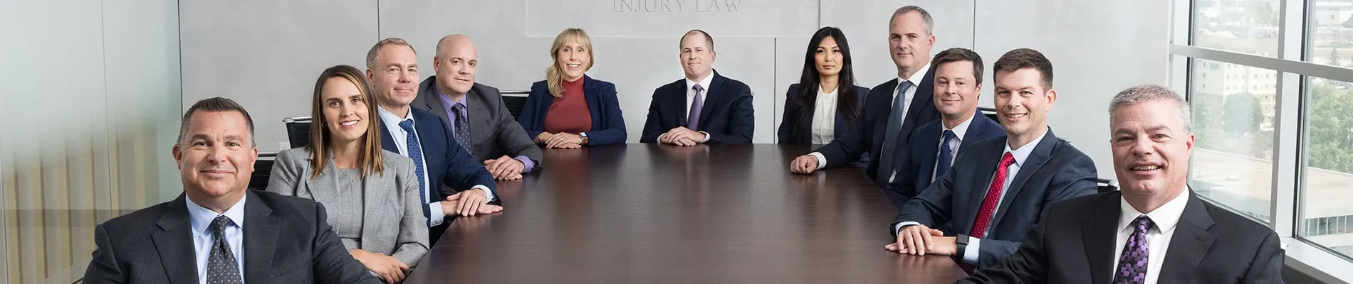 TSR team sitting on a table smiling